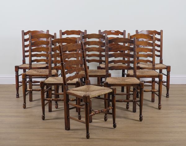 A MATCHED SET OF TEN LANCASHIRE LADDER BACK RUSH SEATED CHAIRS (10)