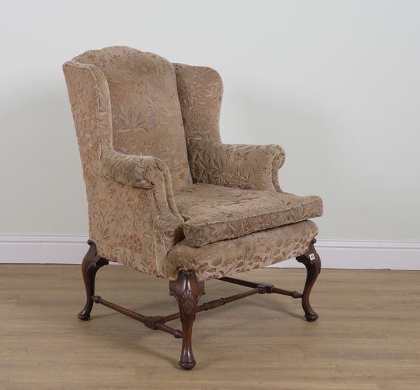 A GEORGE II STYLE MAHOGANY FRAMED WINGBACK ARMCHAIR