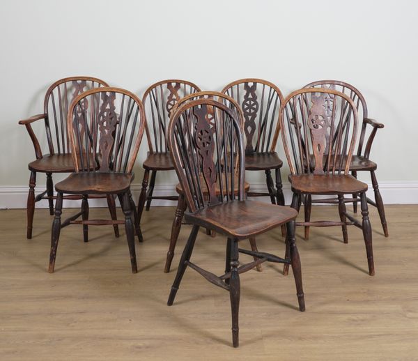 A SET OF EIGHT ASH AND ELM WHEEL BACK DINING CHAIRS (8)