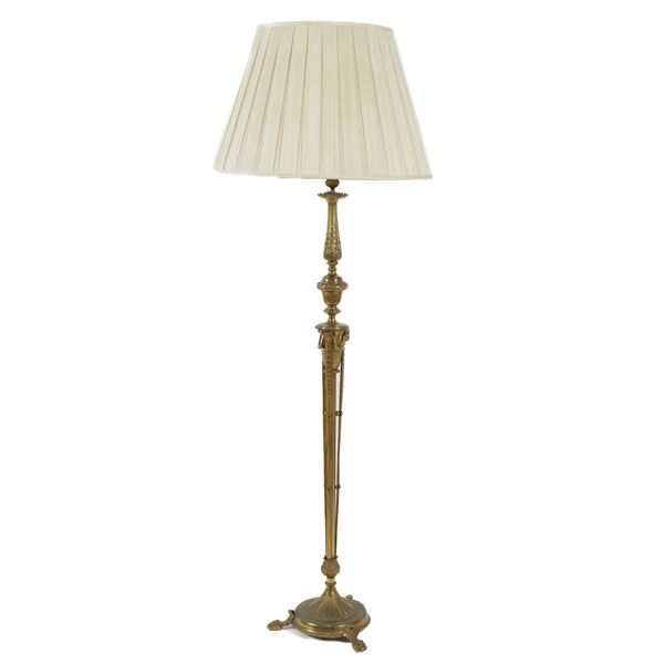 A ROBERT ADAM STYLE GILT-METAL FLOOR STANDING LAMP