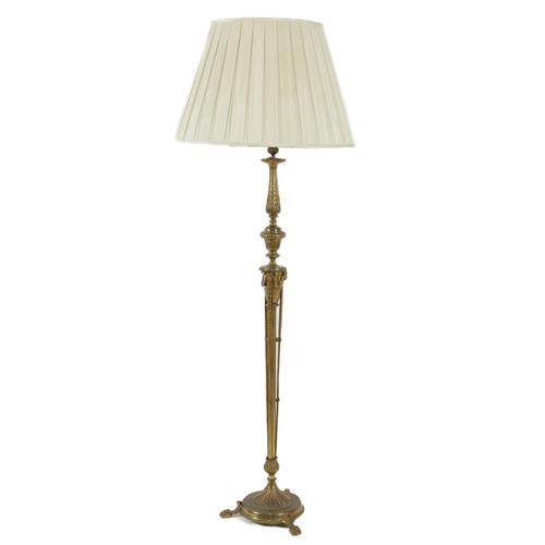 A ROBERT ADAM STYLE GILT-METAL FLOOR STANDING LAMP