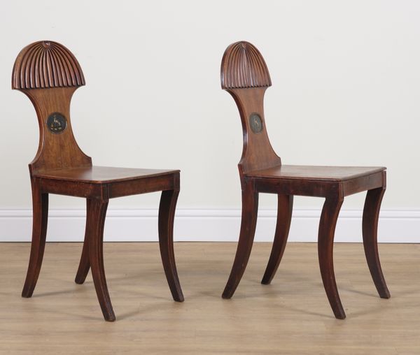 A PAIR OF GEORGE IV MAHOGANY HALL CHAIRS WITH PAINTED DOG CREST (2)