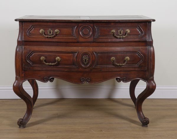 AN 18TH CENTURY CONTINENTAL WALNUT BOMBE TWO DRAWER COMMODE