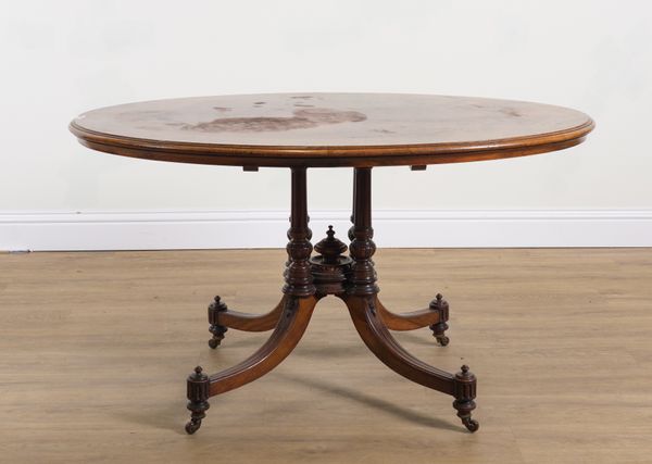 IN THE MANNER OF HOLLAND & SONS; A THUYA AND WALNUT BANDED OVAL CENTRE TABLE