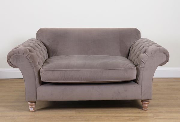 A MODERN GREY UPHOLSTERED SOFA