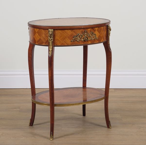 AN EARLY 20TH CENTURY FRENCH GILT METAL MOUNTED PARQUETRY INLAID MAHOGANY OVAL TWO TIER SINGLE DRAWER SIDE TABLE