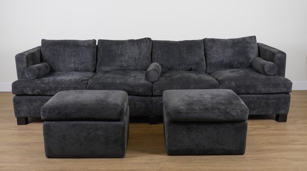 A LARGE GREY UPHOLSTERED FOUR SEAT SOFA (3)