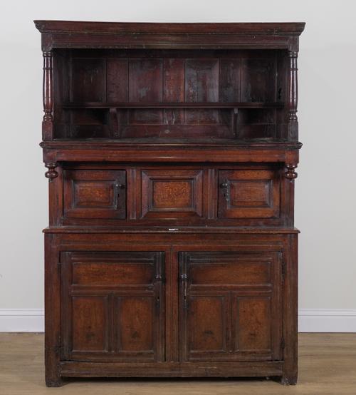 A 17TH CENTURY OAK TRIDARN COURT CUPBOARD