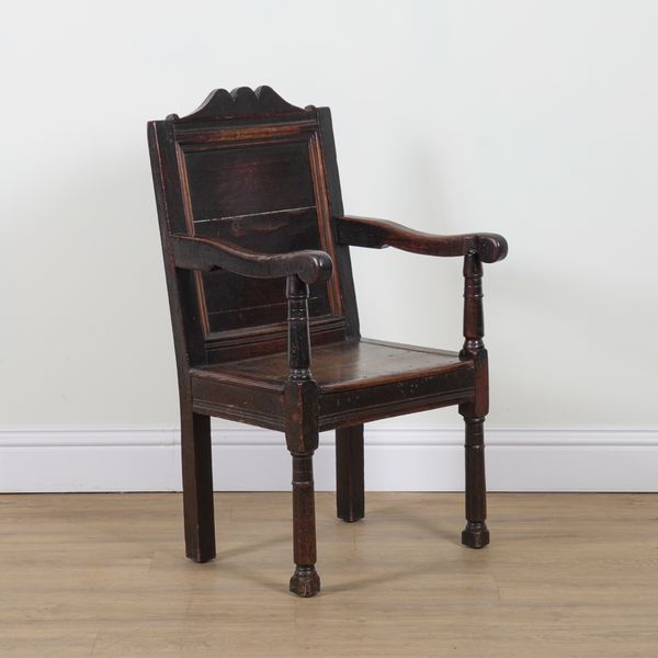 A 17TH CENTURY AND LATER OAK WAINSCOT OPEN ARMCHAIR