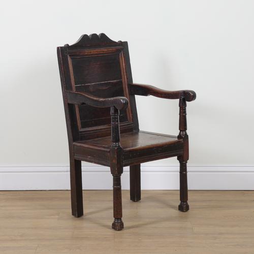 A 17TH CENTURY AND LATER OAK WAINSCOT OPEN ARMCHAIR