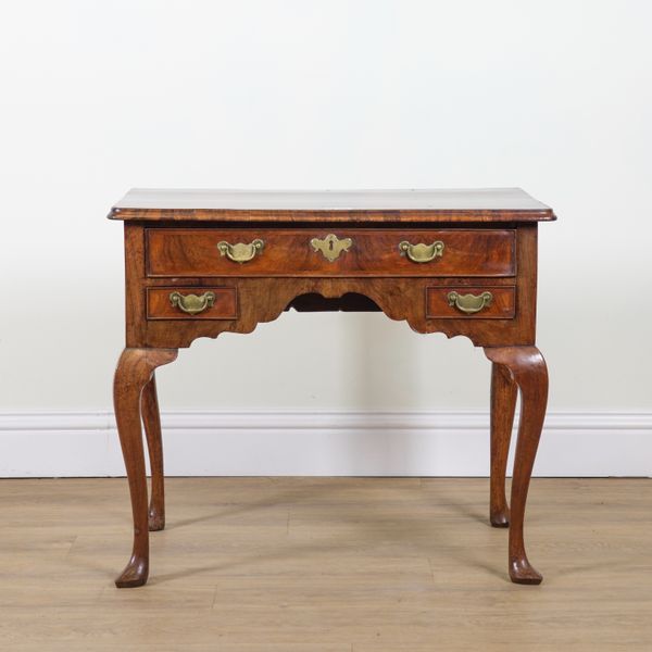 A GEORGE II FIGURED WALNUT LOW BOY