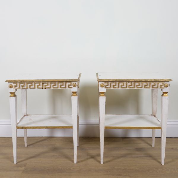 A PAIR OF WHITE PAINTED PARCEL GILT RECTANGULAR TWO TIER OCCASIONAL TABLES