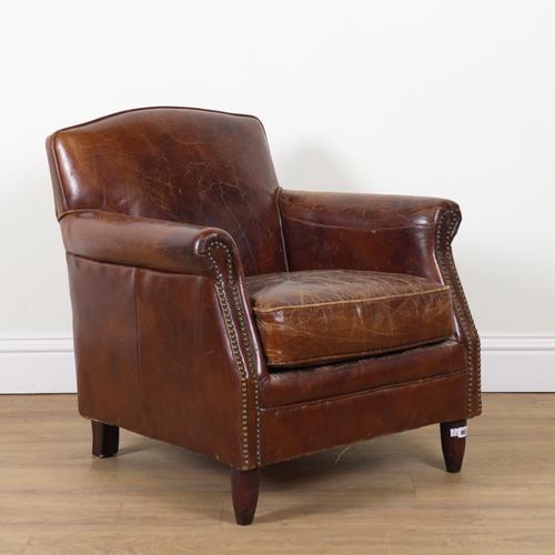 A 1920S FRENCH CLUB STYLE TAN LEATHER UPHOLSTERED EASY ARMCHAIR