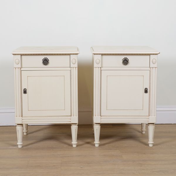 A PAIR OF WHITE PAINTED BEDSIDE CUPBOARDS (2)