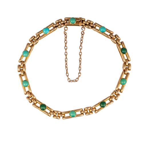 A GOLD AND TURQUOISE BRACELET