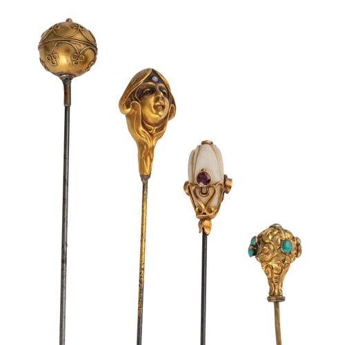 A GROUP OF THREE HAT PINS AND ONE STICK PIN (4)