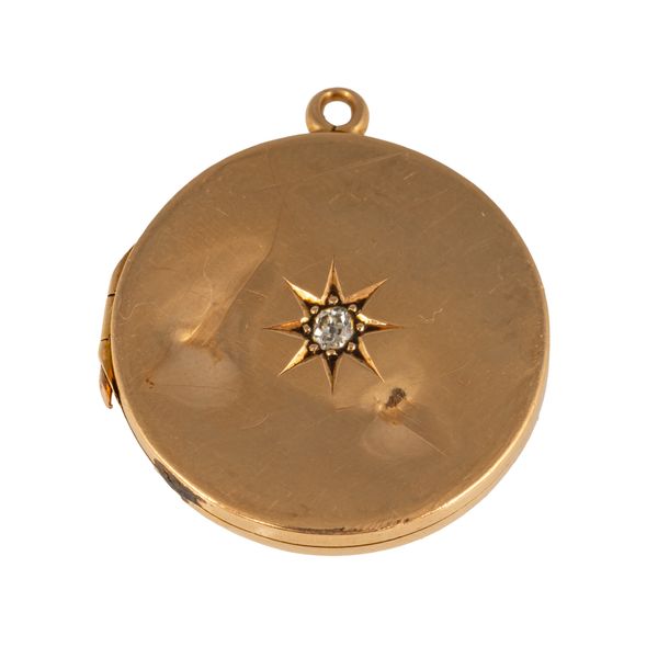 A 15CT GOLD AND DIAMOND CIRCULAR PENDANT LOCKET
