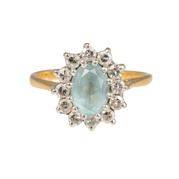 AN 18CT GOLD, AQUAMARINE AND DIAMOND OVAL CLUSTER RING