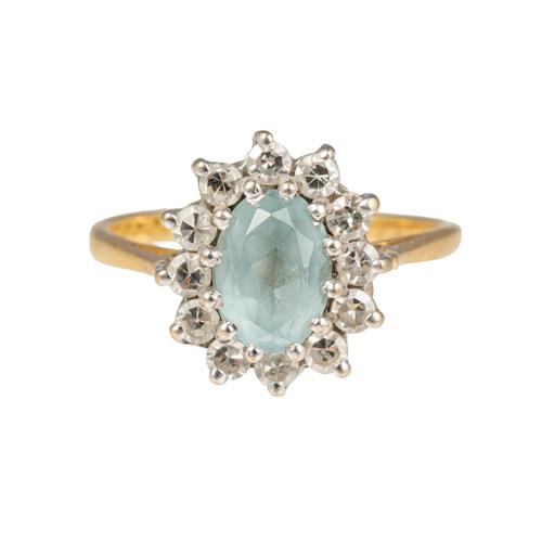 AN 18CT GOLD, AQUAMARINE AND DIAMOND OVAL CLUSTER RING