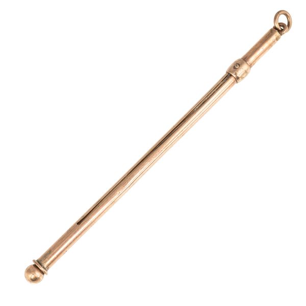 A GOLD SWIZZLE STICK