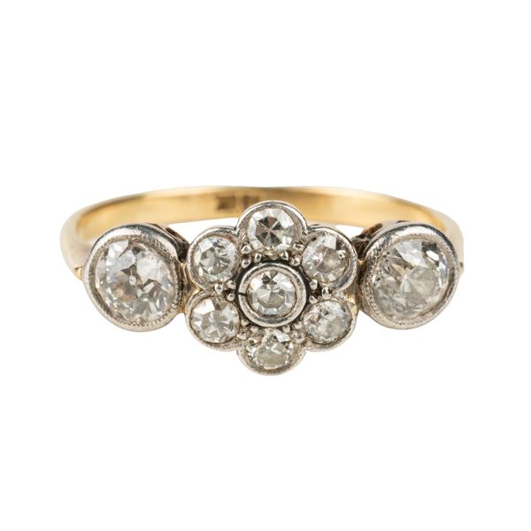 A GOLD AND DIAMOND RING
