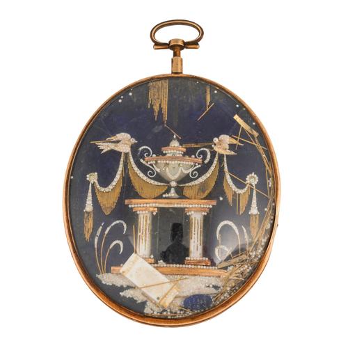A LATE 18TH CENTURY GOLD MOUNTED GLAZED OVAL HAIRLOCKET MOURNING PENDANT