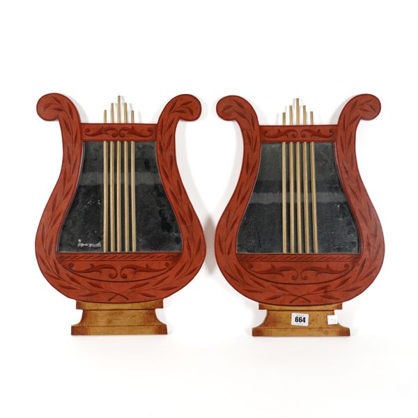 A PAIR OF PARCEL-GILT RED PAINTED LYRE SHAPED WALL MIRRORS (2)