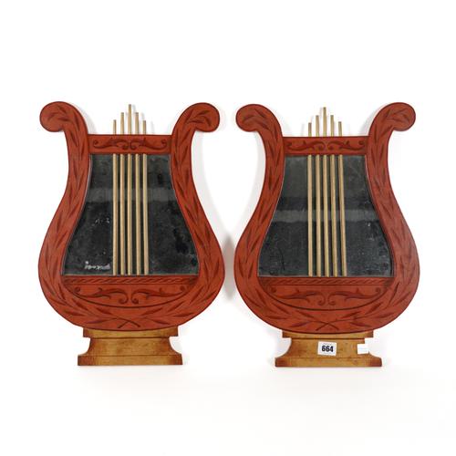 A PAIR OF PARCEL-GILT RED PAINTED LYRE SHAPED WALL MIRRORS (2)