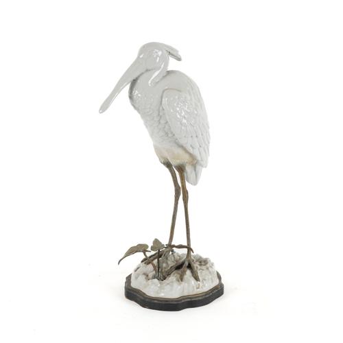 A CONTINENTAL WHITE GLAZED CERAMIC EGRET