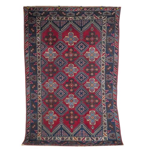 A GROUP OF FOUR RUGS AND A CUSHION (5)