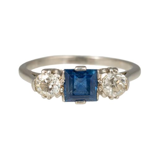A SAPPHIRE AND DIAMOND THREE STONE RING