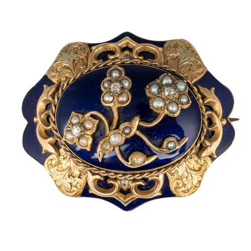 A VICTORIAN DIAMOND, HALF PEARL AND BLUE ENAMELLED SHAPED OVAL MOURNING BROOCH