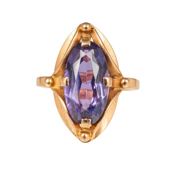 A RUSSIAN GOLD AND SYNTHETIC MAUVE GEM SET DRESS RING