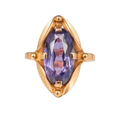 A RUSSIAN GOLD AND SYNTHETIC MAUVE GEM SET DRESS RING