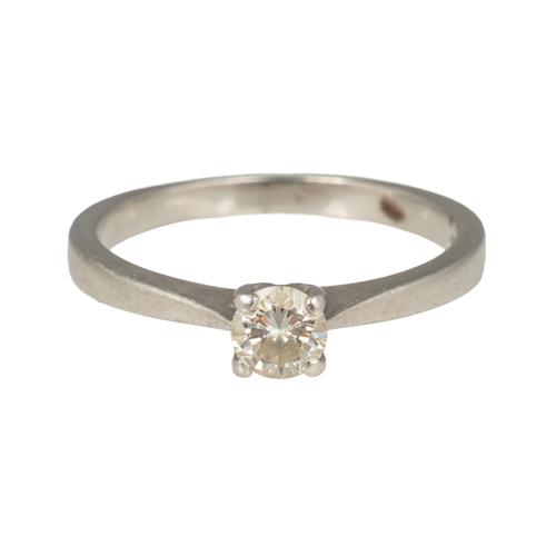 A PLATINUM AND DIAMOND SINGLE STONE RING
