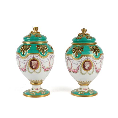 A PAIR OF MINTON GREEN-GROUND POT POURRI VASES AND COVERS (4)