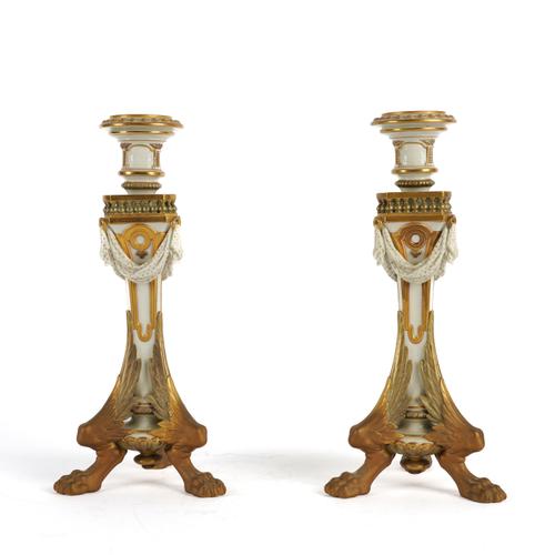 A PAIR OF ROYAL WORCESTER CANDLESTICKS (2)