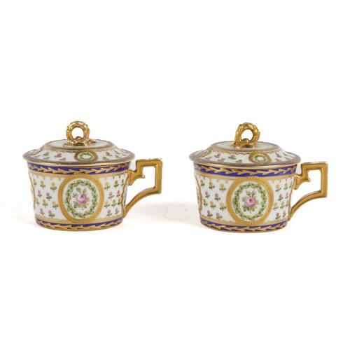 A PAIR OF SEVRES STYLE CUPS AND COVERS (4)