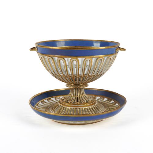 A PARIS PORCELAIN RETICULATED BLUE AND GILT TWO-HANDLED CIRCULAR BASKET AND STAND