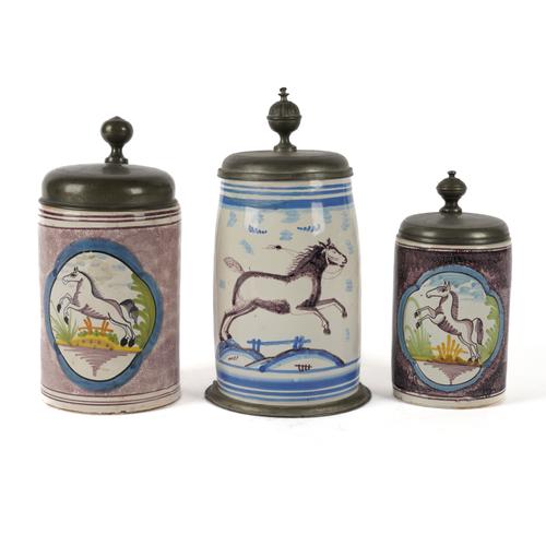 THREE GERMAN FAIENCE PEWTER-MOUNTED TANKARDS (3)