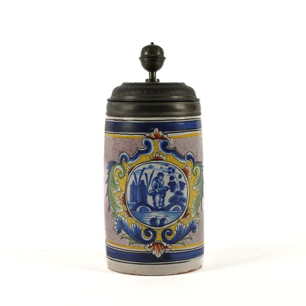 A GERMAN FAIENCE PEWTER-MOUNTED TANKARD
