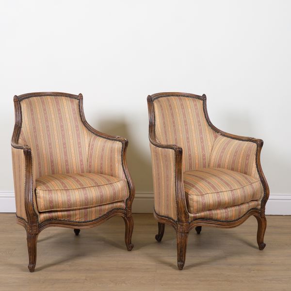 A PAIR OF LOUIS XV STYLE STAINED BEECH EASY ARMCHAIRS (2)