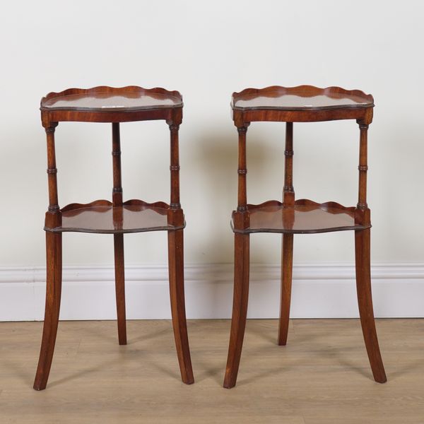 A PAIR OF GEORGE III STYLE MAHOGANY SHAPED TWO TIER OCCASIONAL TABLES (2)