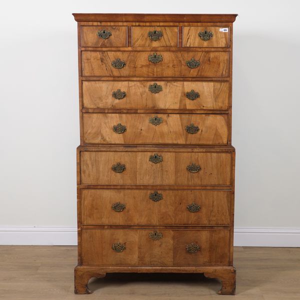 A GEORGE II FIGURED WALNUT CHEST ON CHEST