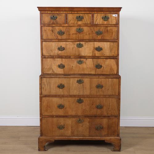 A GEORGE II FIGURED WALNUT CHEST ON CHEST
