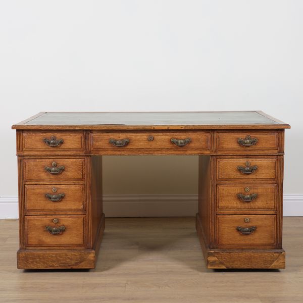 A LATE 19TH CENTURY OAK PEDESTAL DESK