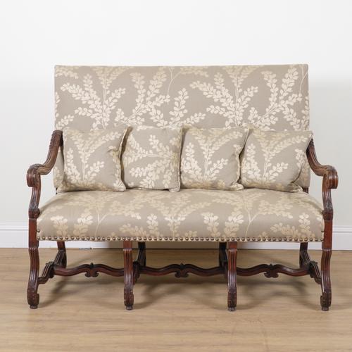 A 19TH CENTURY FRENCH OAK FRAMED UPHOLSTERED OPEN ARM SETTEE
