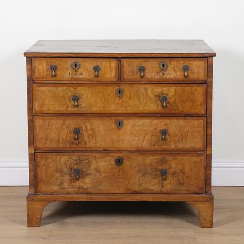 A GEORGE I AND LATER FIGURED WALNUT CHEST OF DRAWERS