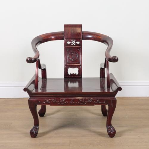 A CHINESE HARWOOD HORSESHOE BACK LOW ARMCHAIR