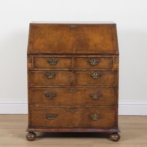A GEORGE II STYLE FIGURED WALNUT BUREAU